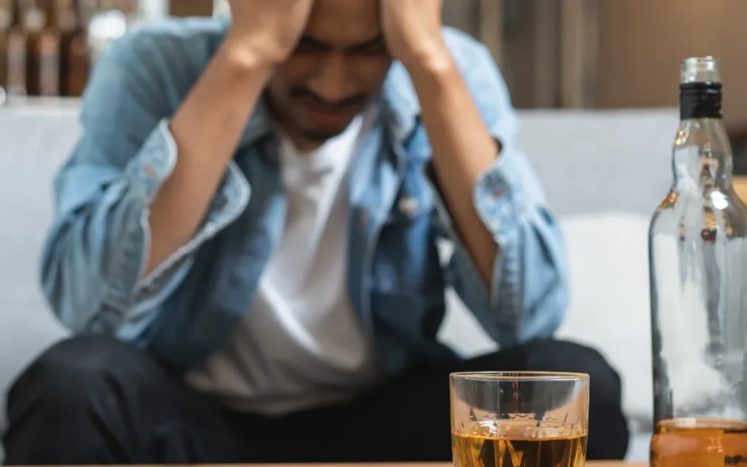 Young man drinking alcohol too much