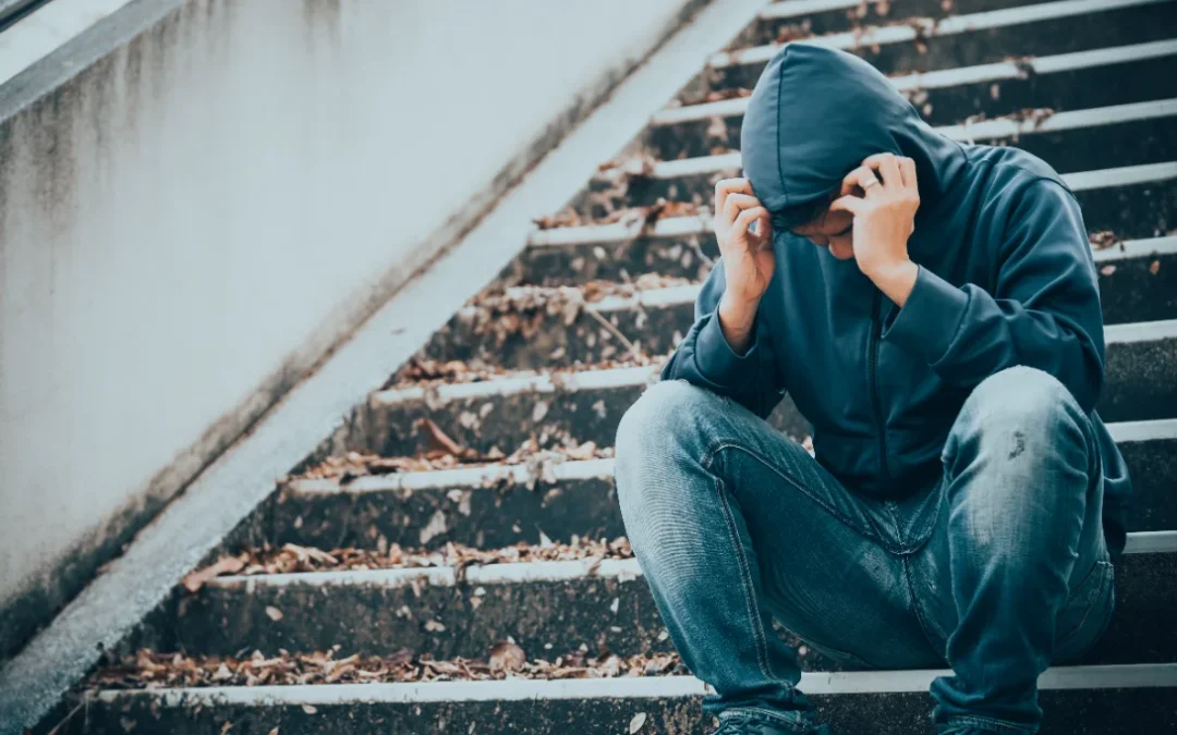 drug addict man sitting on the floor